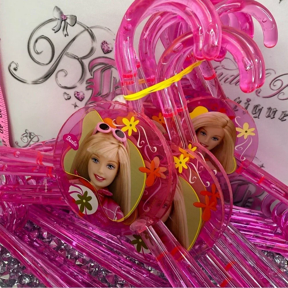 12 Barbie hangers 2001 Bright Pink acrylic Plastic Hangers with Character Accent